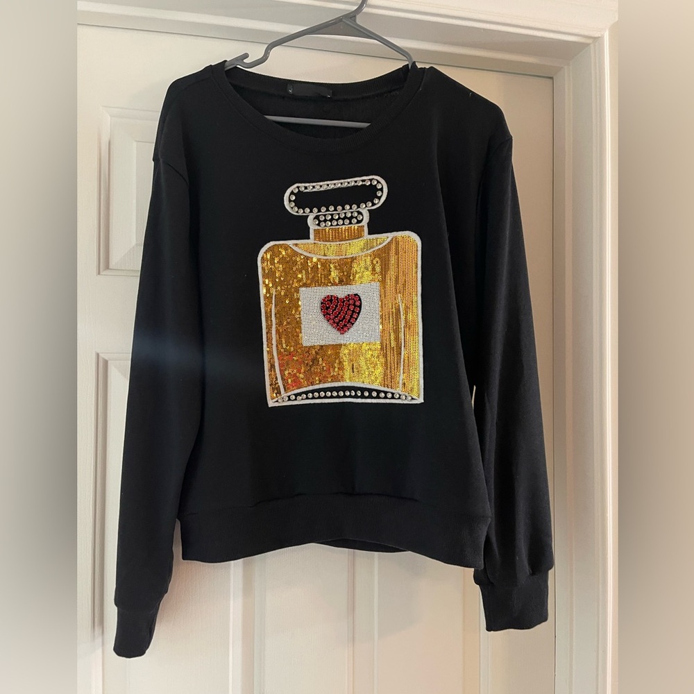 Black Sweatshirt with Gold Perfume Bottle Design